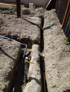 a newly dug sprinkler trench